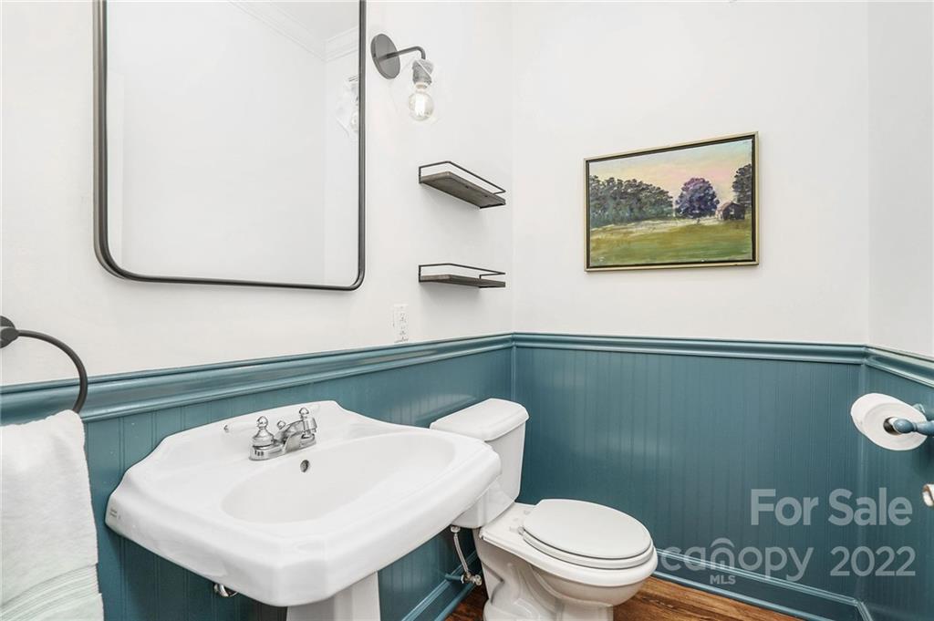 1520 Paddock Circle Charlotte, NC 28209 - Photo 17 of 39 a bathroom with a toilet a sink and mirror