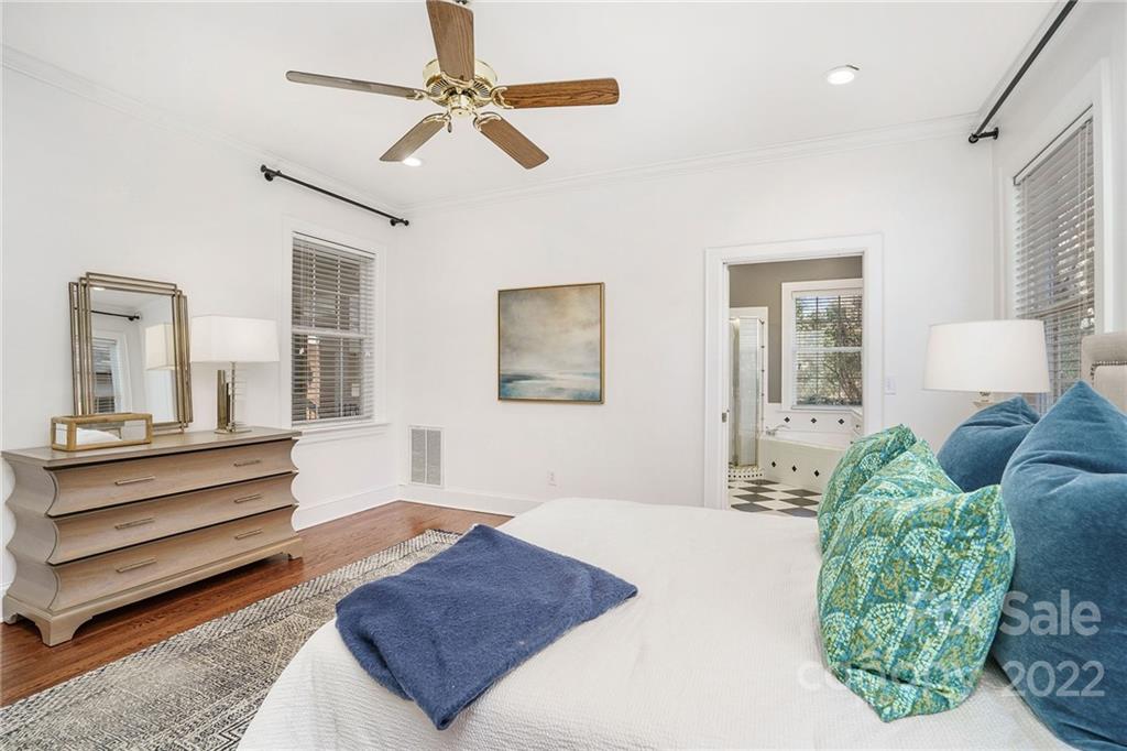 1520 Paddock Circle Charlotte, NC 28209 - Photo 21 of 39 a bedroom with a bed and ceiling fan