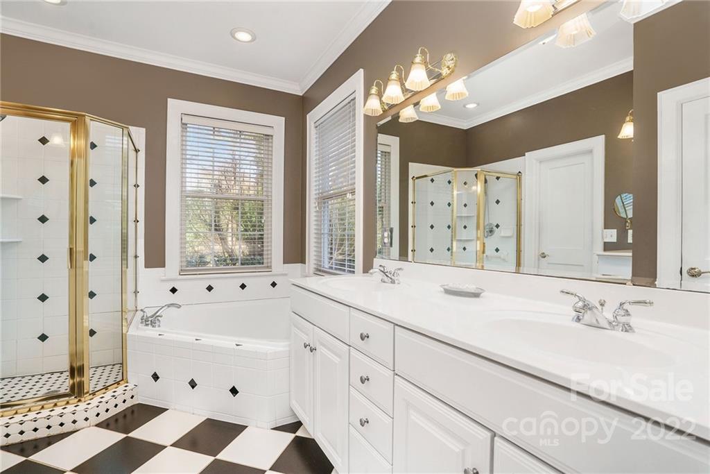 1520 Paddock Circle Charlotte, NC 28209 - Photo 22 of 39 a bathroom with a sink double vanity granite and a bathtub