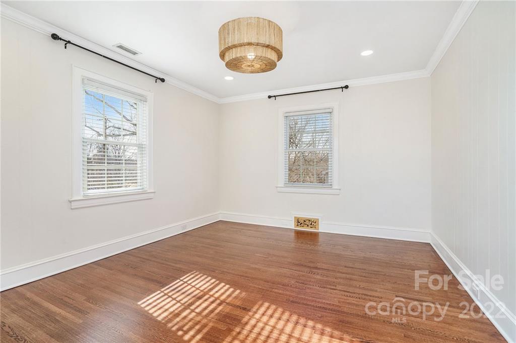 1520 Paddock Circle Charlotte, NC 28209 - Photo 25 of 39 an empty room with wooden floor and windows