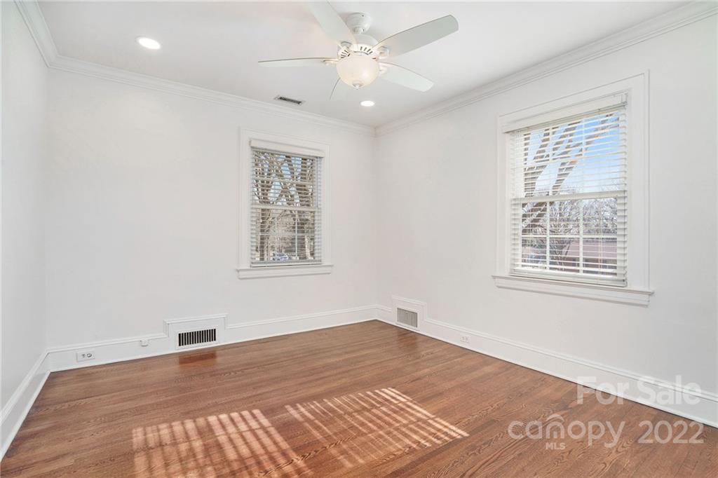 1520 Paddock Circle Charlotte, NC 28209 - Photo 27 of 39 an empty room with wooden floor and windows