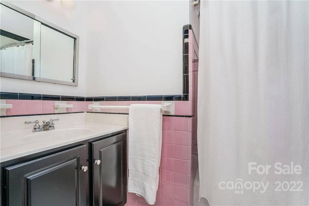 1520 Paddock Circle Charlotte, NC 28209 - Photo 29 of 39 a utility room with a sink and a mirror