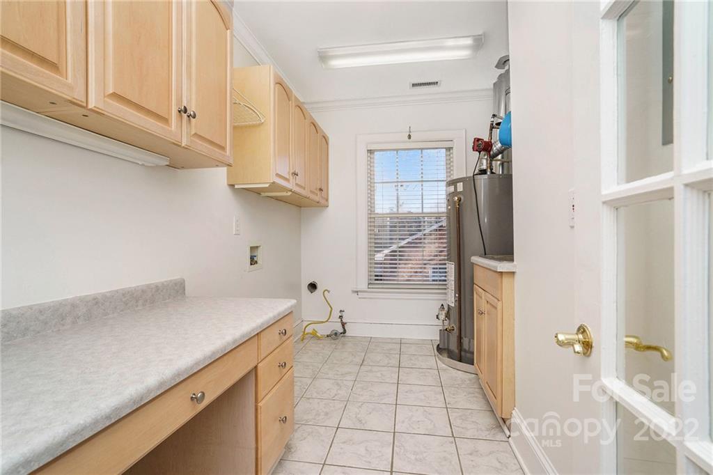 1520 Paddock Circle Charlotte, NC 28209 - Photo 30 of 39 a kitchen with a sink and refrigerator