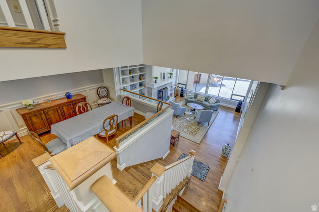9699 Bypass Road, Unit 5 Alta, UT 84092 - Photo 33 of 54 Hardwood flooring visible throughout, including the grand staircase with white balusters and wood handrails