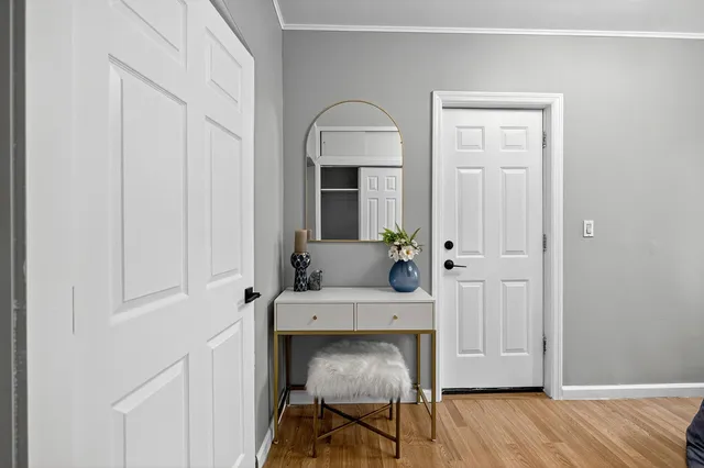 a view of an entryway with wooden floor