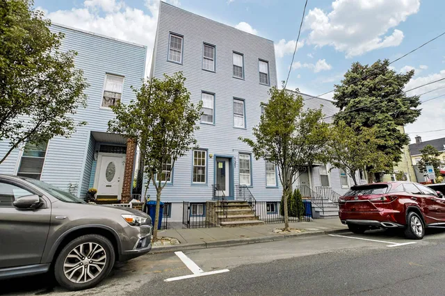 a car parked in front of a house