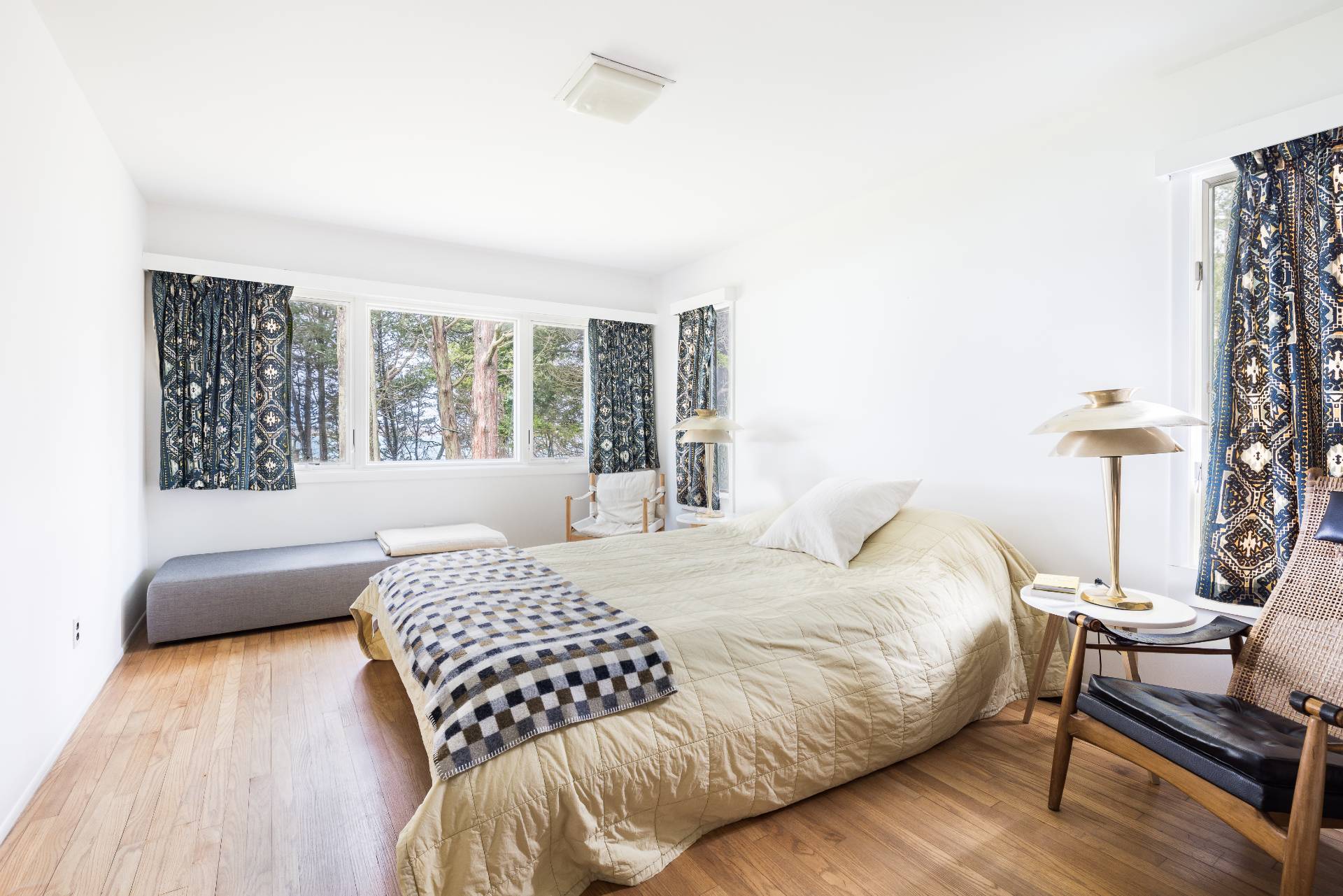291 Three Mile Harbor Road East Hampton, NY 11937 - Photo 11 of 17 a bedroom with a bed and a couch with outer view