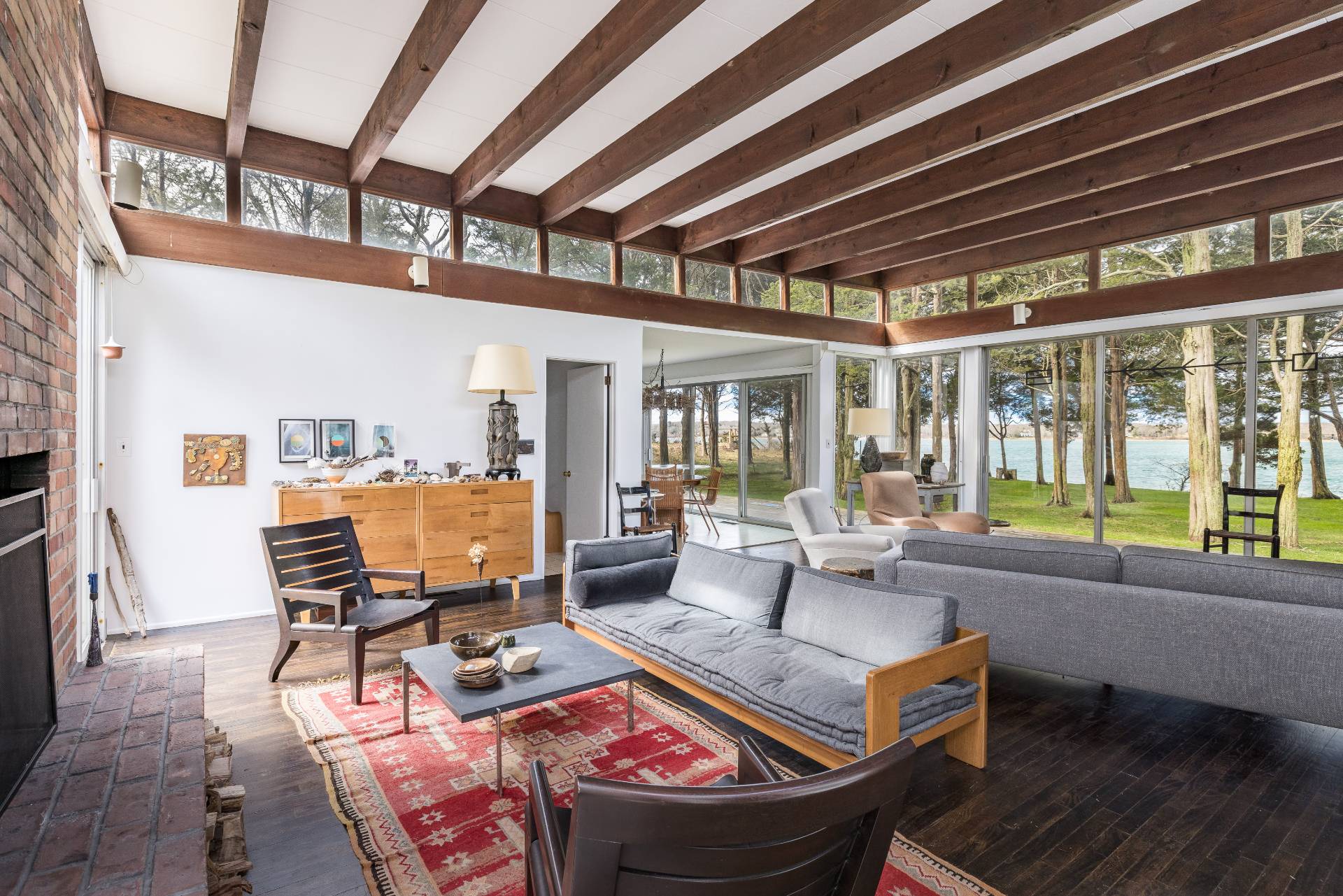 291 Three Mile Harbor Road East Hampton, NY 11937 - Photo 6 of 17 a living room with furniture and a floor to ceiling window