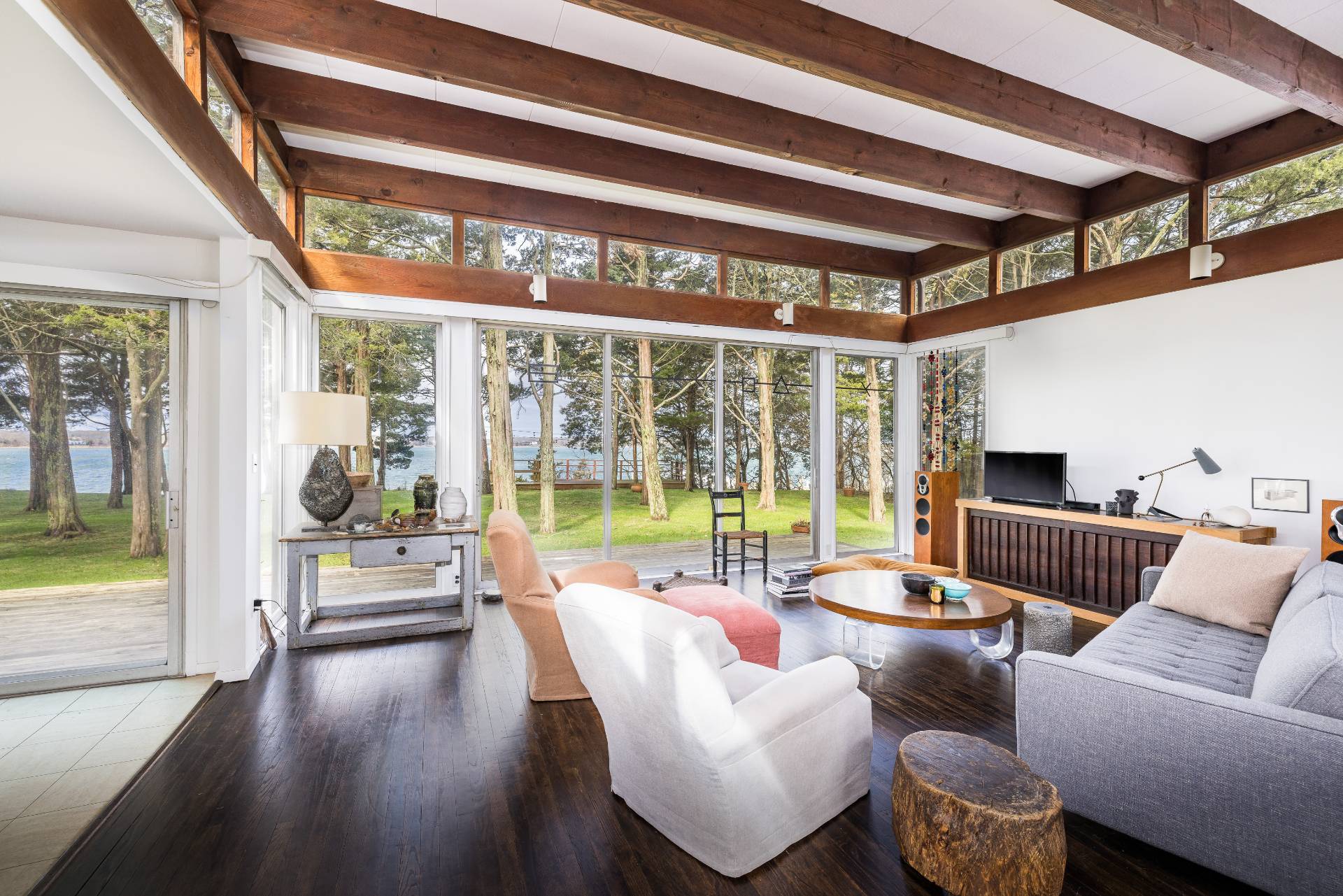291 Three Mile Harbor Road East Hampton, NY 11937 - Photo 7 of 17 a living room with furniture and a floor to ceiling window