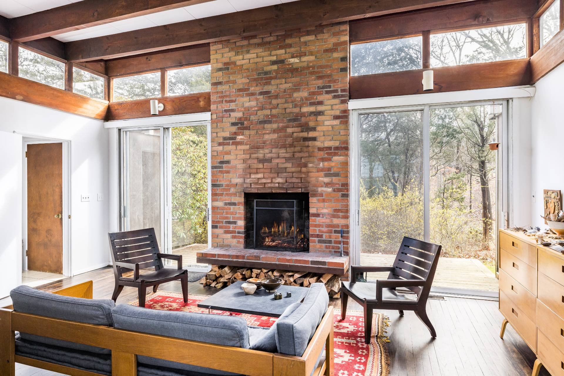 291 Three Mile Harbor Road East Hampton, NY 11937 - Photo 8 of 17 a living room with furniture and a fireplace