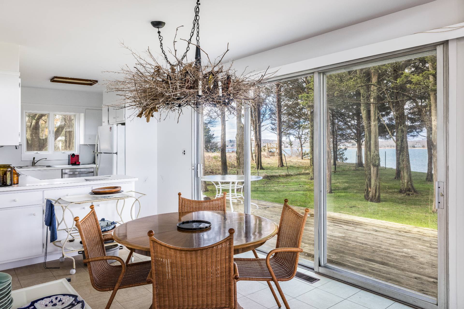 291 Three Mile Harbor Road East Hampton, NY 11937 - Photo 10 of 17 a living room with furniture and a floor to ceiling window