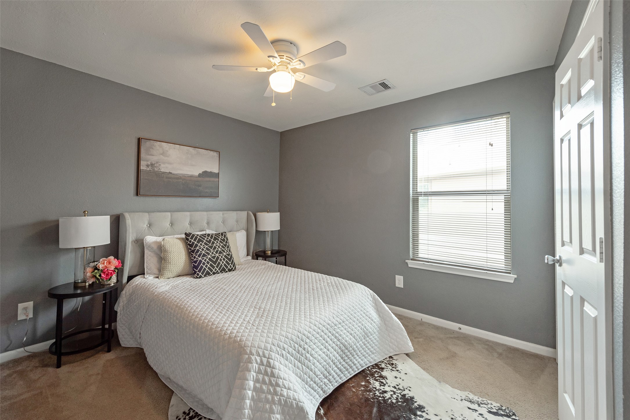 3554 Bennett Trails Drive Spring, TX 77386 - Photo 35 of 44 a bedroom with a bed and a chandelier