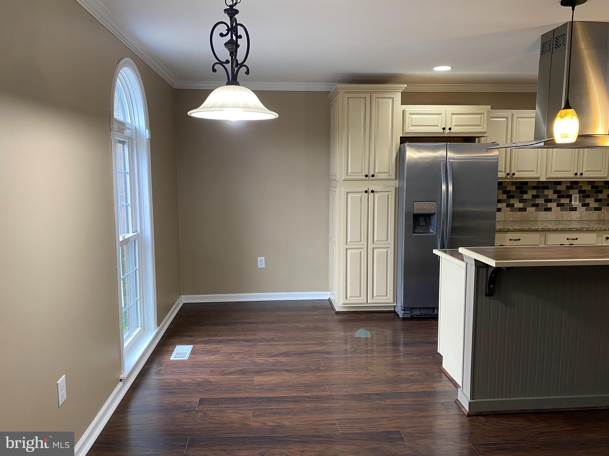 4 Victoria Square Frederick, MD 21702 - Photo 11 of 38 a kitchen with stainless steel appliances a refrigerator and a stove