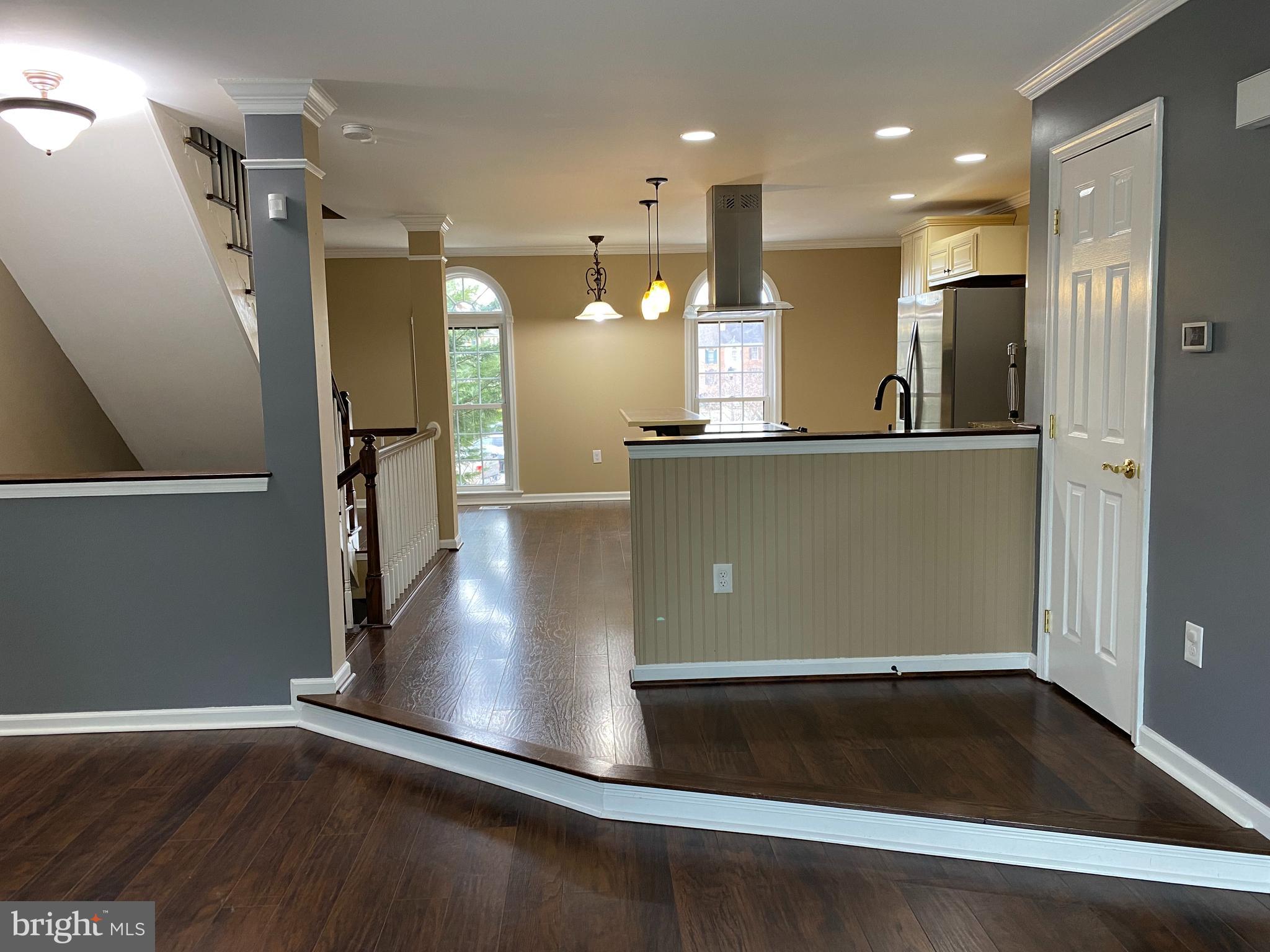 4 Victoria Square Frederick, MD 21702 - Photo 17 of 38 a view of kitchen with cabinets and wooden floor