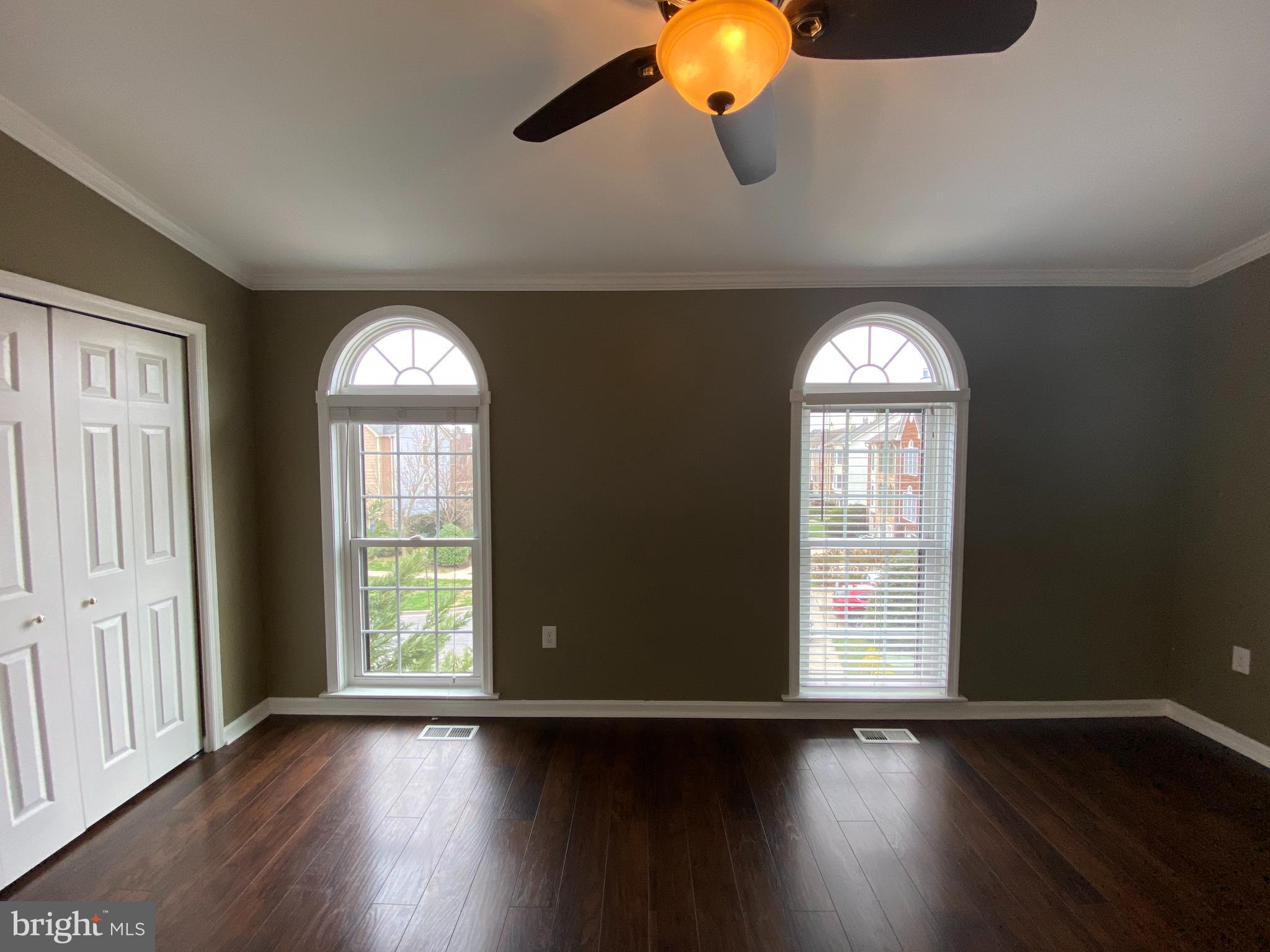 4 Victoria Square Frederick, MD 21702 - Photo 19 of 38 an empty room with wooden floor and windows