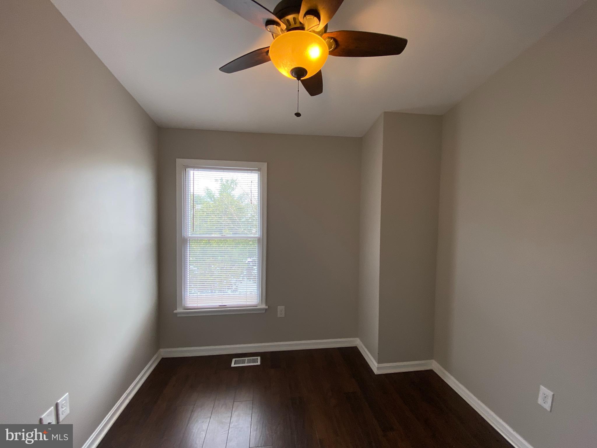 4 Victoria Square Frederick, MD 21702 - Photo 20 of 38 wooden floor in an empty room with a window