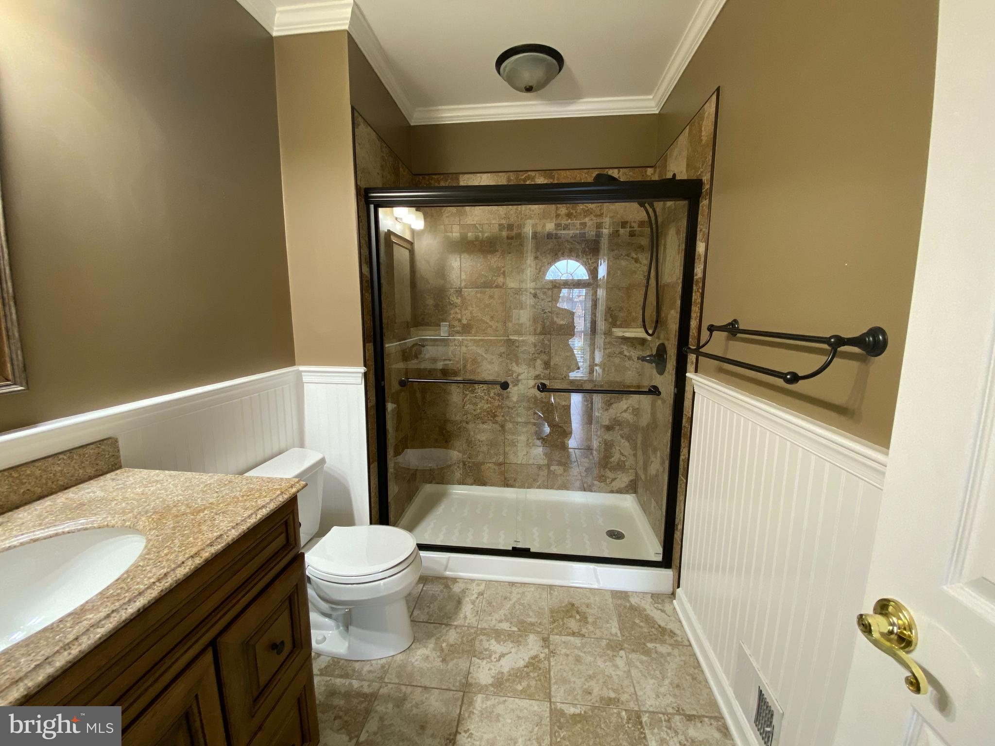 4 Victoria Square Frederick, MD 21702 - Photo 24 of 38 a bathroom with a granite countertop sink mirror vanity and toilet