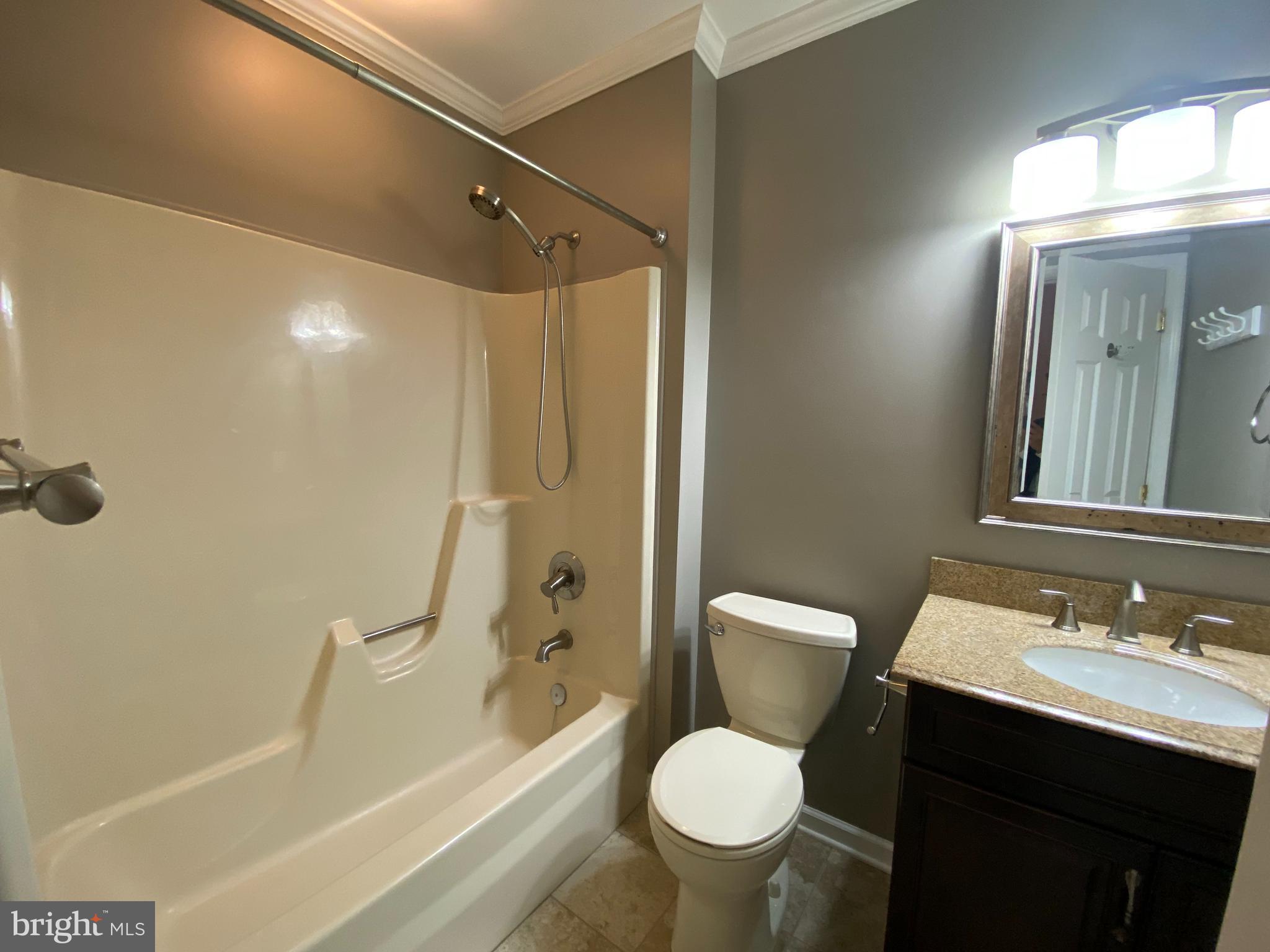 4 Victoria Square Frederick, MD 21702 - Photo 27 of 38 a bathroom with a sink toilet and shower