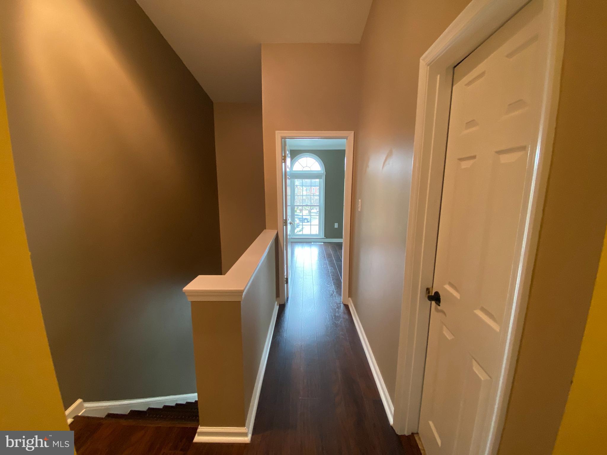 4 Victoria Square Frederick, MD 21702 - Photo 29 of 38 a view of a hallway with wooden floor