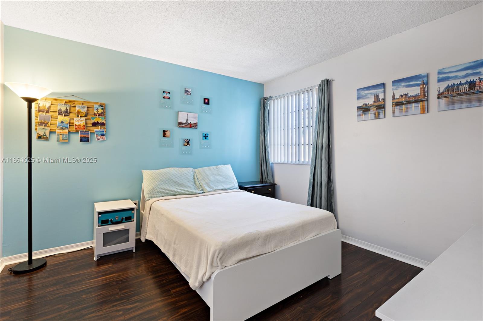 13402 Southwest 153rd Street, Unit 1905 Miami, FL 33177 - Photo 12 of 21 a bedroom with a bed and wooden floor