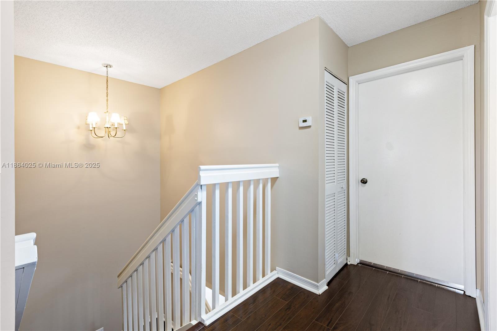 13402 Southwest 153rd Street, Unit 1905 Miami, FL 33177 - Photo 14 of 21 a view of a hallway with wooden floor