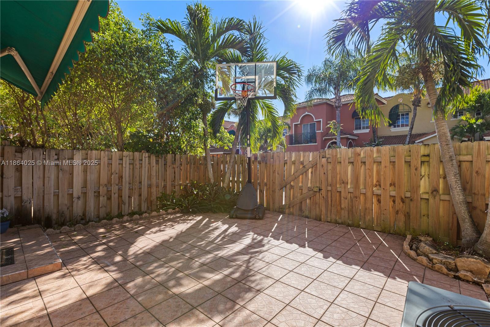 13402 Southwest 153rd Street, Unit 1905 Miami, FL 33177 - Photo 19 of 21 a front view of a house with a garden
