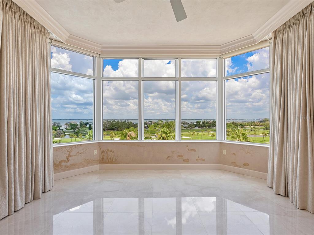 655 Longboat Club Road, Unit 16B Longboat Key, FL 34228 - Photo 18 of 50 a view of an empty room with wooden floor and a window