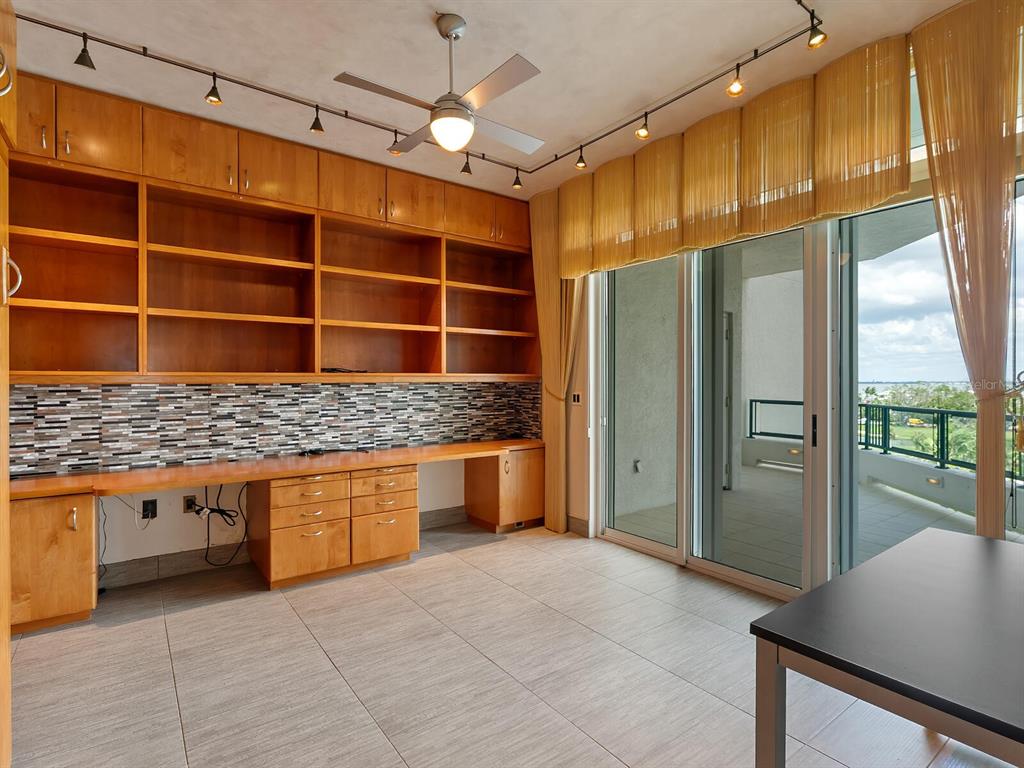 655 Longboat Club Road, Unit 16B Longboat Key, FL 34228 - Photo 29 of 50 a kitchen with stainless steel appliances granite countertop a refrigerator and a sink