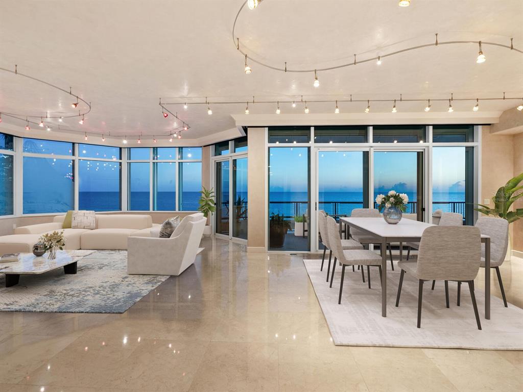 655 Longboat Club Road, Unit 16B Longboat Key, FL 34228 - Photo 39 of 50 a view of a dining room with furniture a kitchen and chandelier