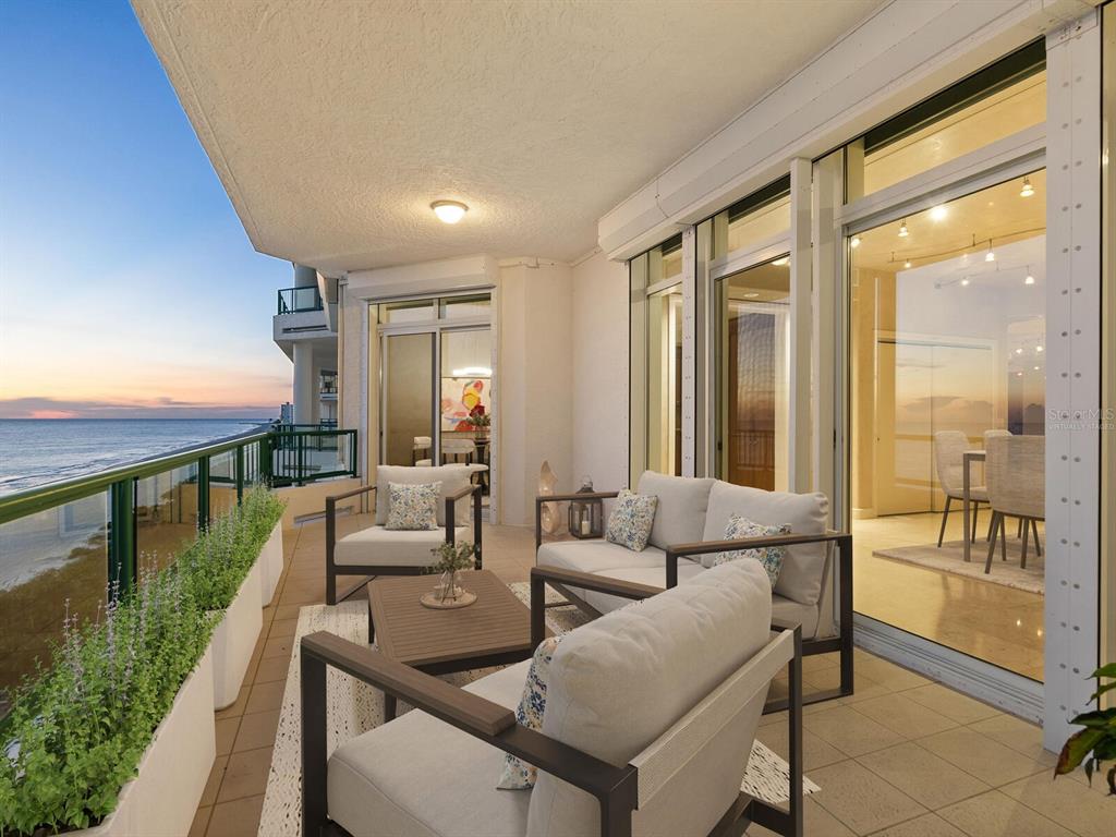 655 Longboat Club Road, Unit 16B Longboat Key, FL 34228 - Photo 46 of 50 a living room with furniture and a floor to ceiling window