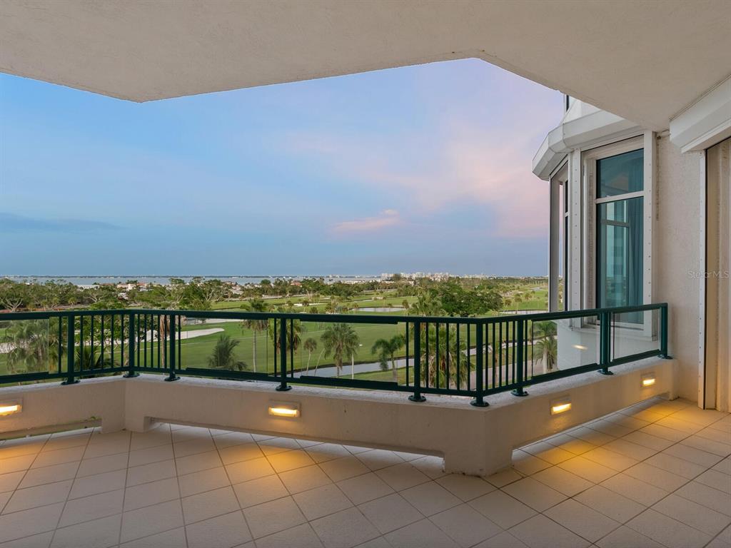 655 Longboat Club Road, Unit 16B Longboat Key, FL 34228 - Photo 47 of 50 a view of a terrace with a bench
