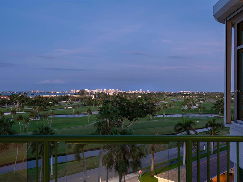 655 Longboat Club Road, Unit 16B Longboat Key, FL 34228 - Photo 48 of 50 a view of a table and a chair under an umbrella