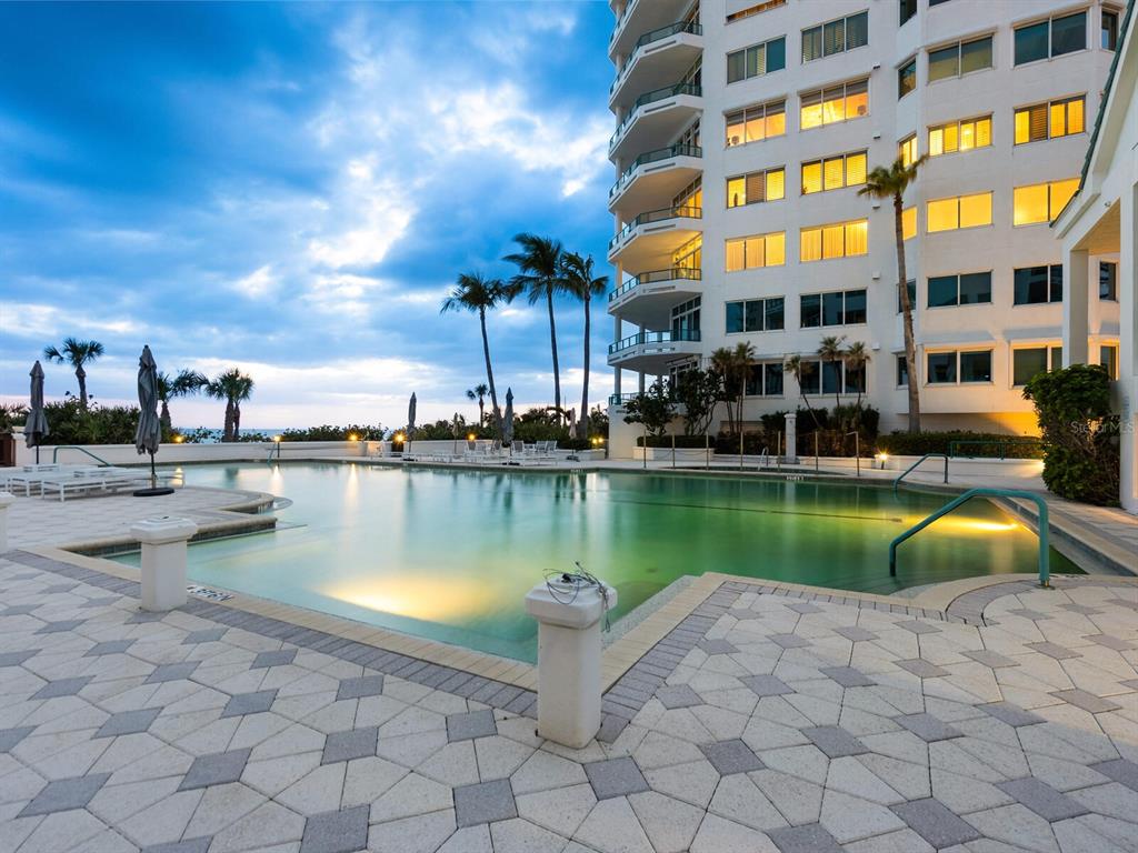 655 Longboat Club Road, Unit 16B Longboat Key, FL 34228 - Photo 49 of 50 a swimming pool with outdoor seating and yard