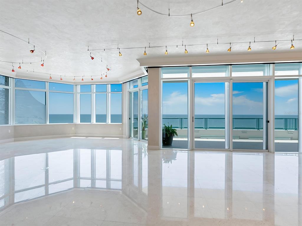 655 Longboat Club Road, Unit 16B Longboat Key, FL 34228 - Photo 5 of 50 a living room with a balcony