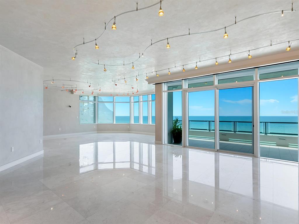 655 Longboat Club Road, Unit 16B Longboat Key, FL 34228 - Photo 6 of 50 a view of a hallway with a ceiling fan