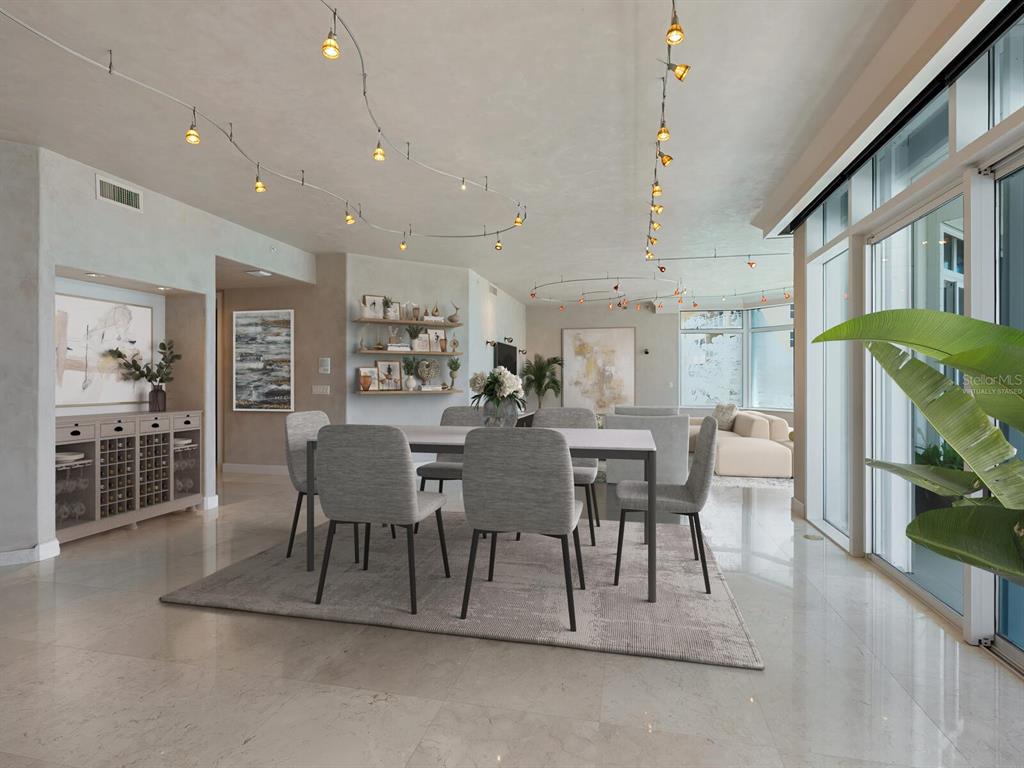 655 Longboat Club Road, Unit 16B Longboat Key, FL 34228 - Photo 10 of 50 a view of a dining room with furniture