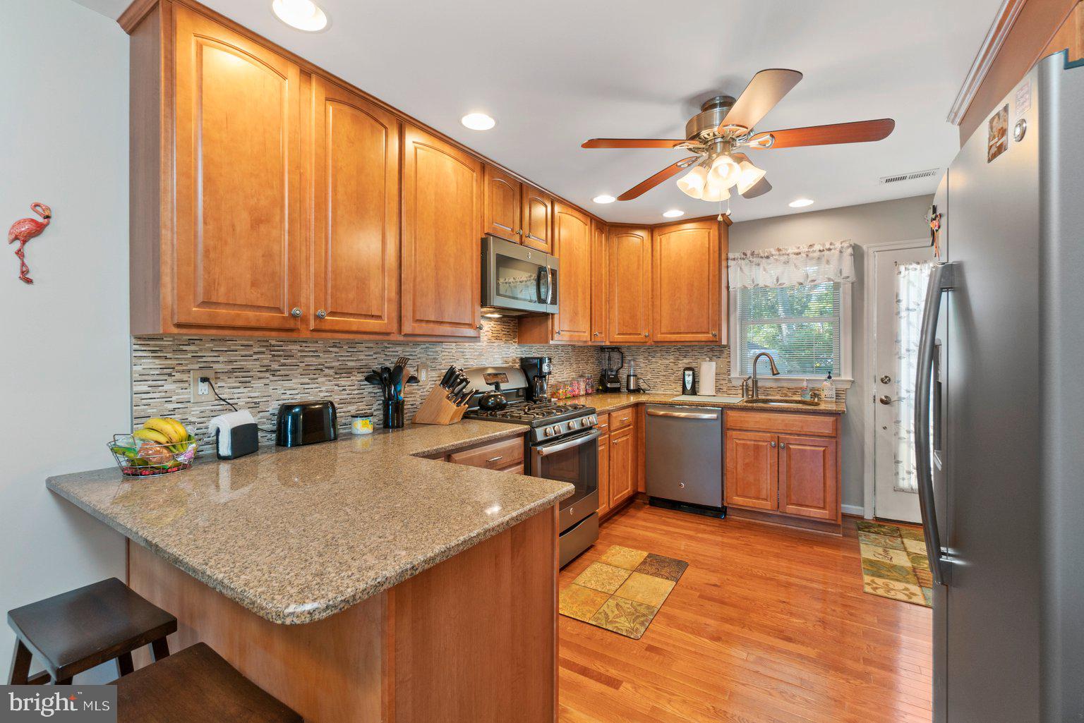 202 Stonewall Road Catonsville, MD 21228 - Photo 14 of 65 Granite countertops + breakfast bar ( in-law) area