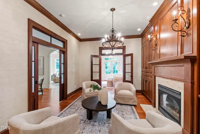 a bedroom with a bed and a flat tv screen on the dresser
