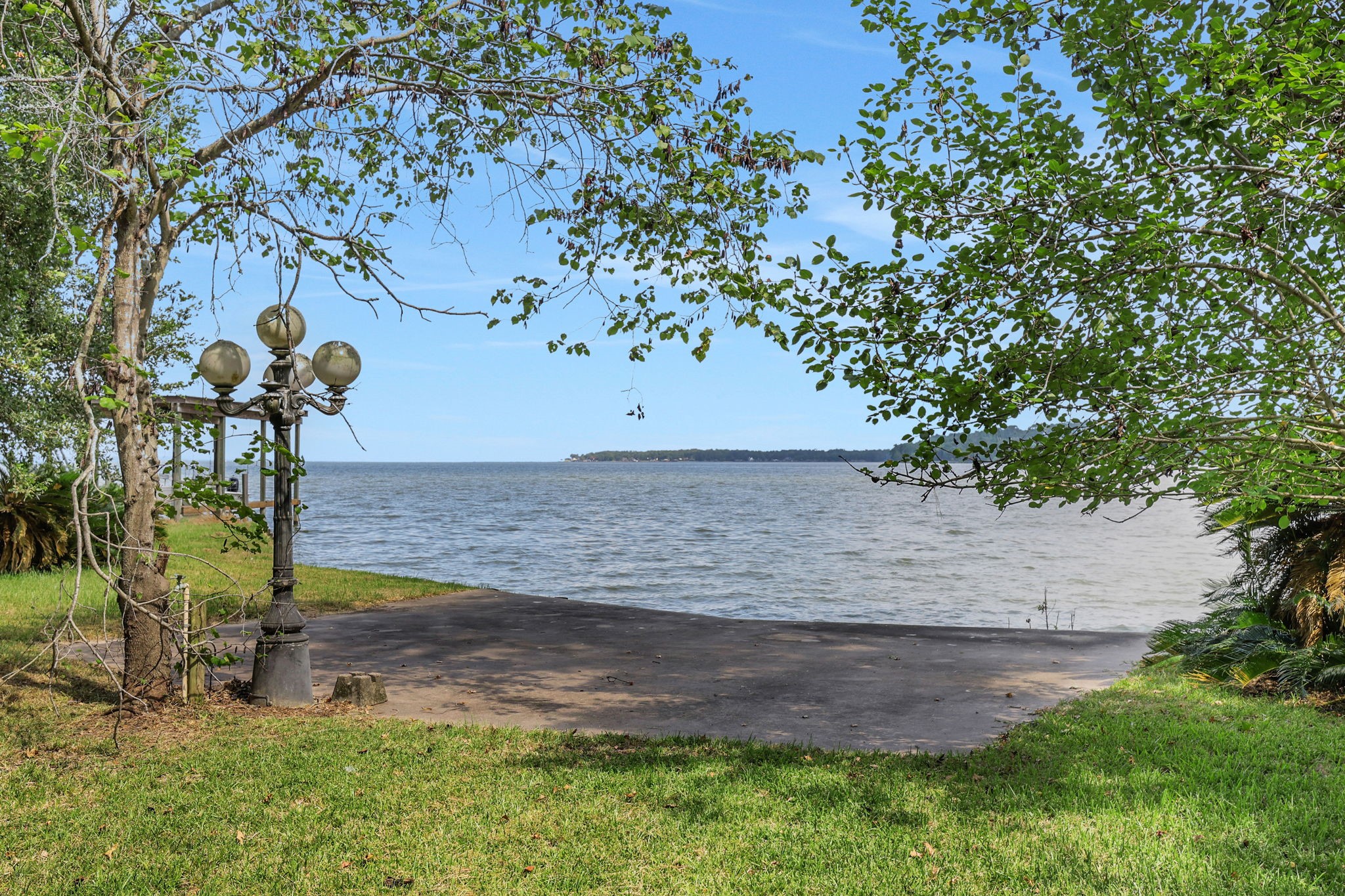 200 Johnson Road Coldspring, TX 77331 - Photo 41 of 47 The patio area by the bulkhead is a great spot to enjoy the lake breeze