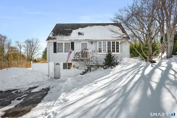 a front view of house with yard outdoor seating and barbeque oven