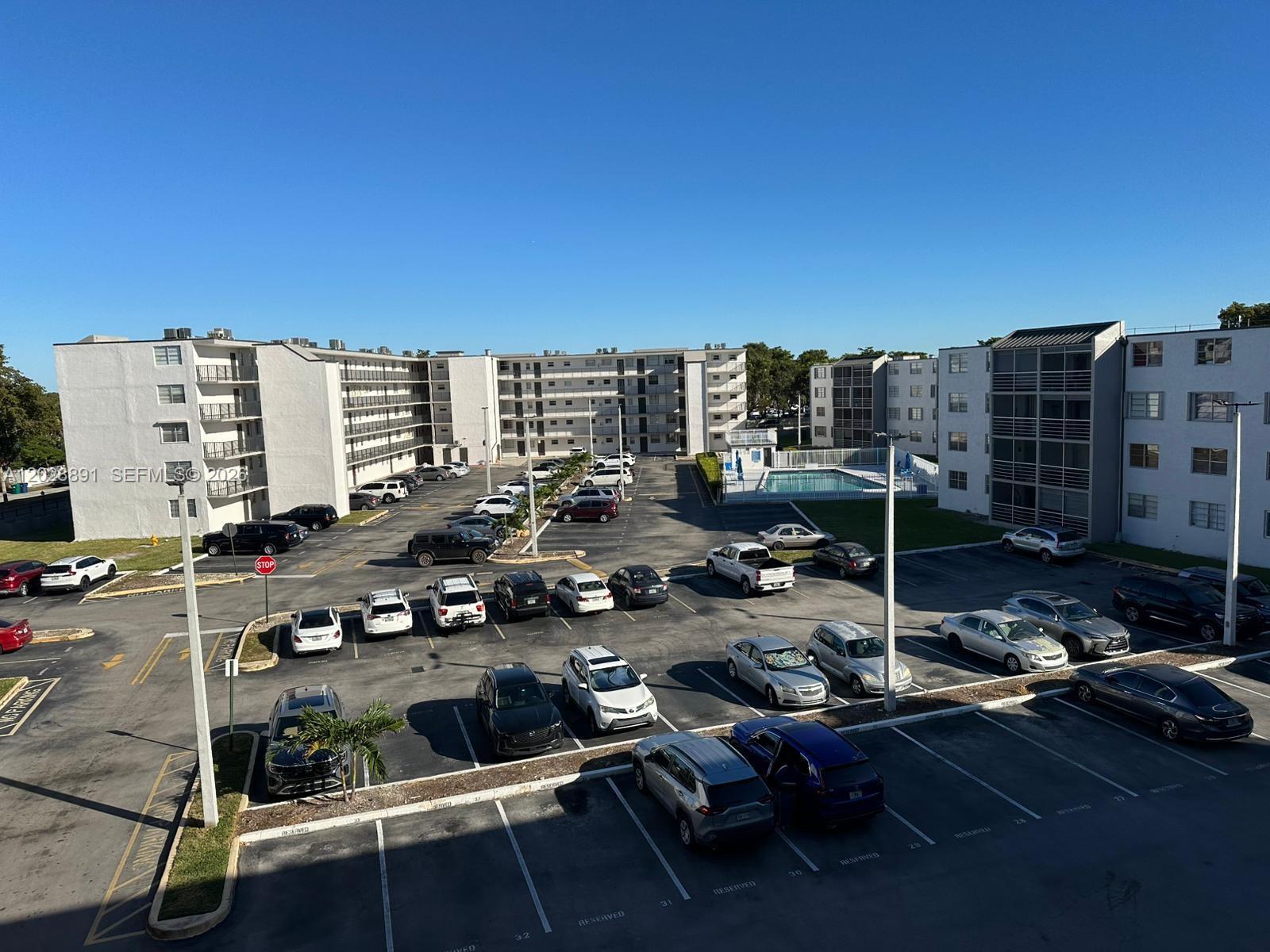 14170 Southwest 84th Street, Unit 402F Miami, FL 33183 - Photo 34 of 36 Aerial View of the Parking Lot and Pool