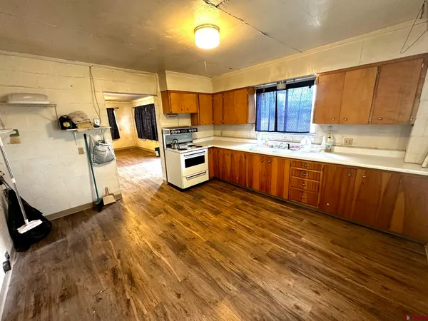 a large kitchen with lot of cabinets