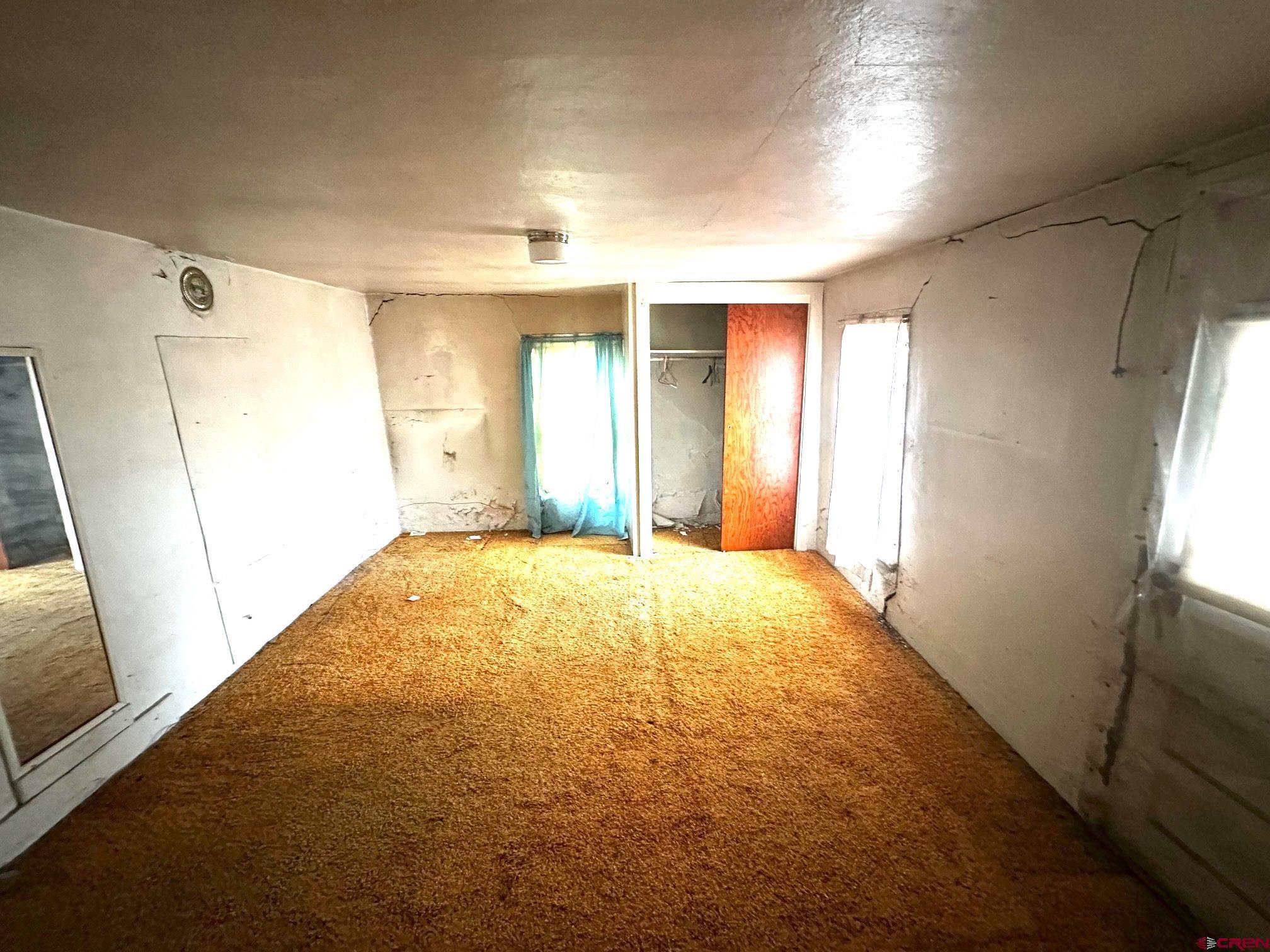 417 South Oak Street Cortez, CO 81321 - Photo 18 of 25 a view of an empty room with a window