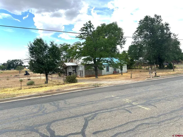a view of a building with a road