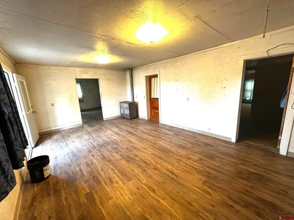 a view of a livingroom with wooden floor