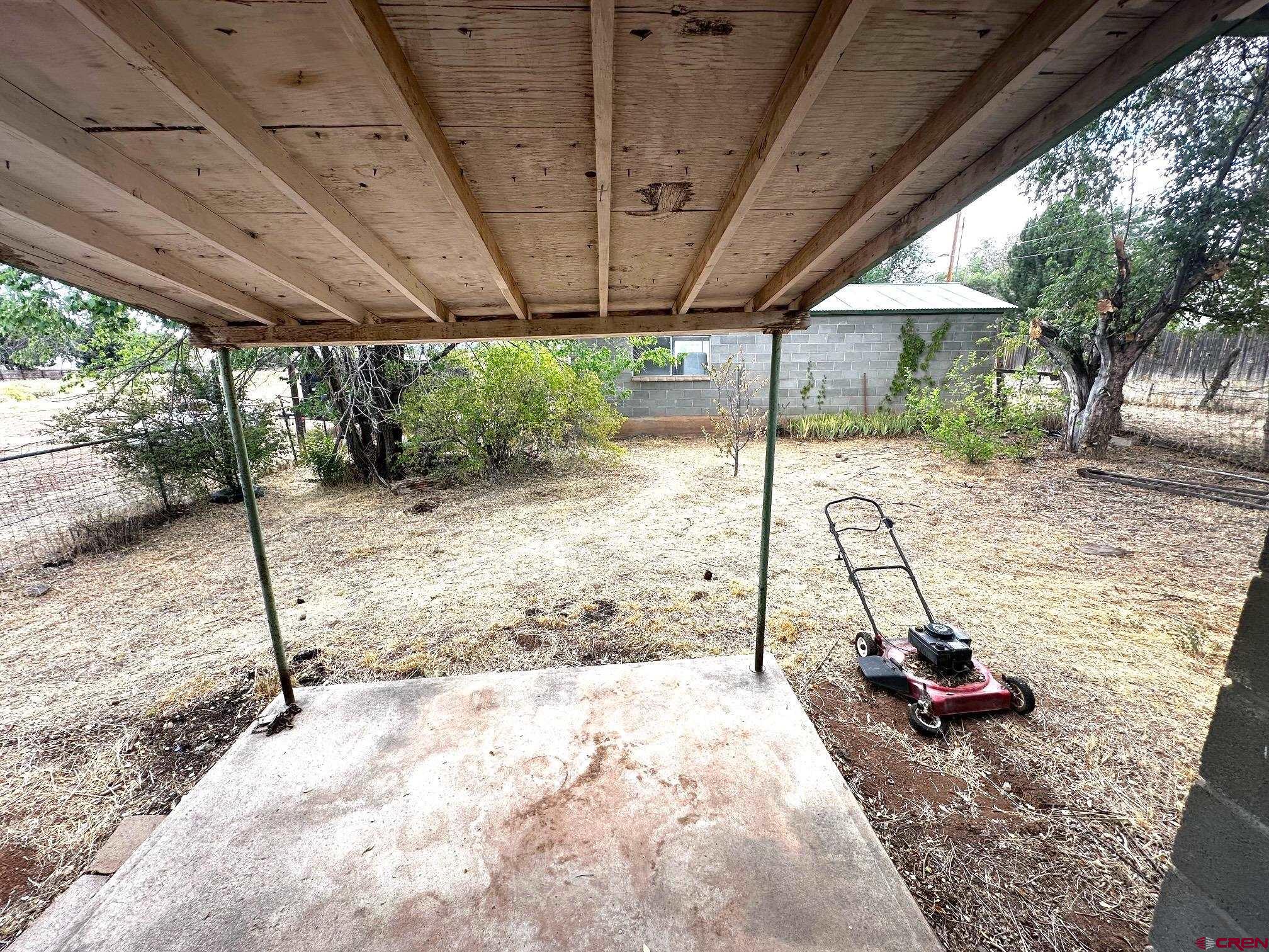 417 South Oak Street Cortez, CO 81321 - Photo 4 of 25 a view of a backyard with a table and chairs