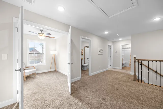 a view of an empty room with windows