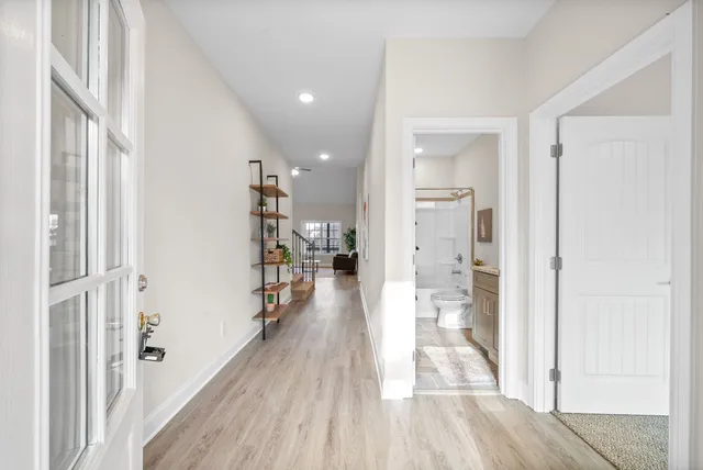a view of a living room with a wooden floor