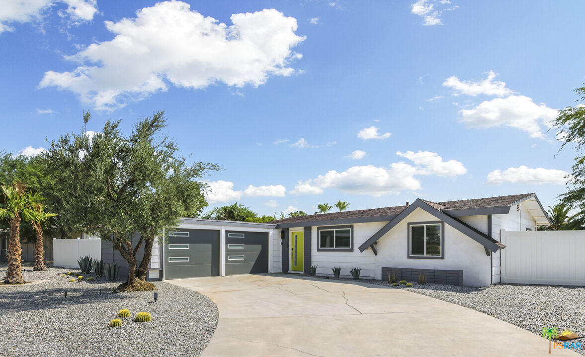 2312 North Blando Road Palm Springs, CA 92262 - Photo 1 of 27 a front view of a house with a yard and garage