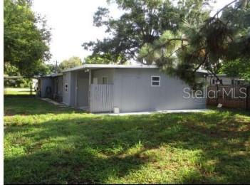 a backyard of a house with lots of green space